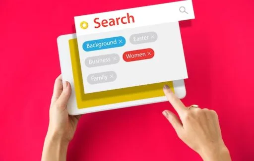 Illustration of a keyword suggestion tool with computer screen, search bar, documents, and key symbol representing SEO analysis